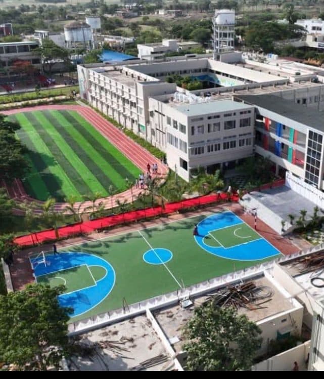 Aerial view of the campus, sports ground and courts