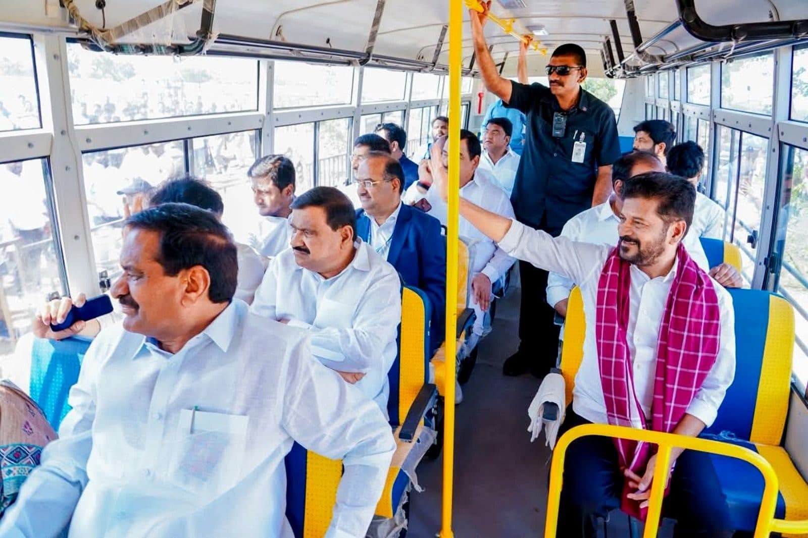 The Chief Minister riding in a school bus